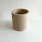 Speckled sand concrete planter on a white background