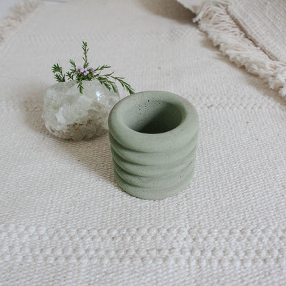 small jar in olive green color