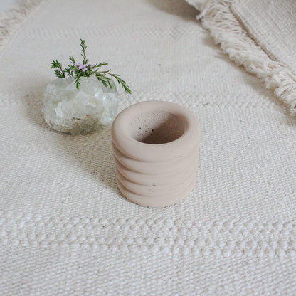 small jar in sand color