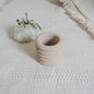 small jar in sand color