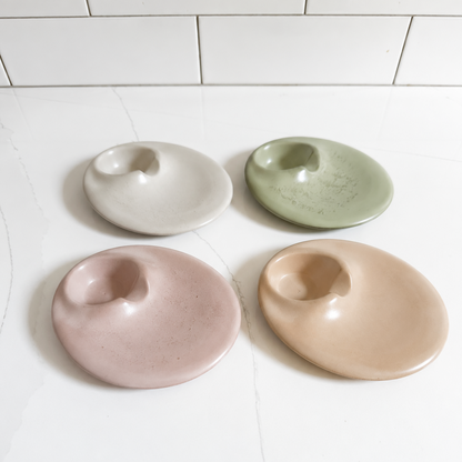 Picture showing palo santo & sage holders in assorted colors, light gray, sand, sage green, dusty pink