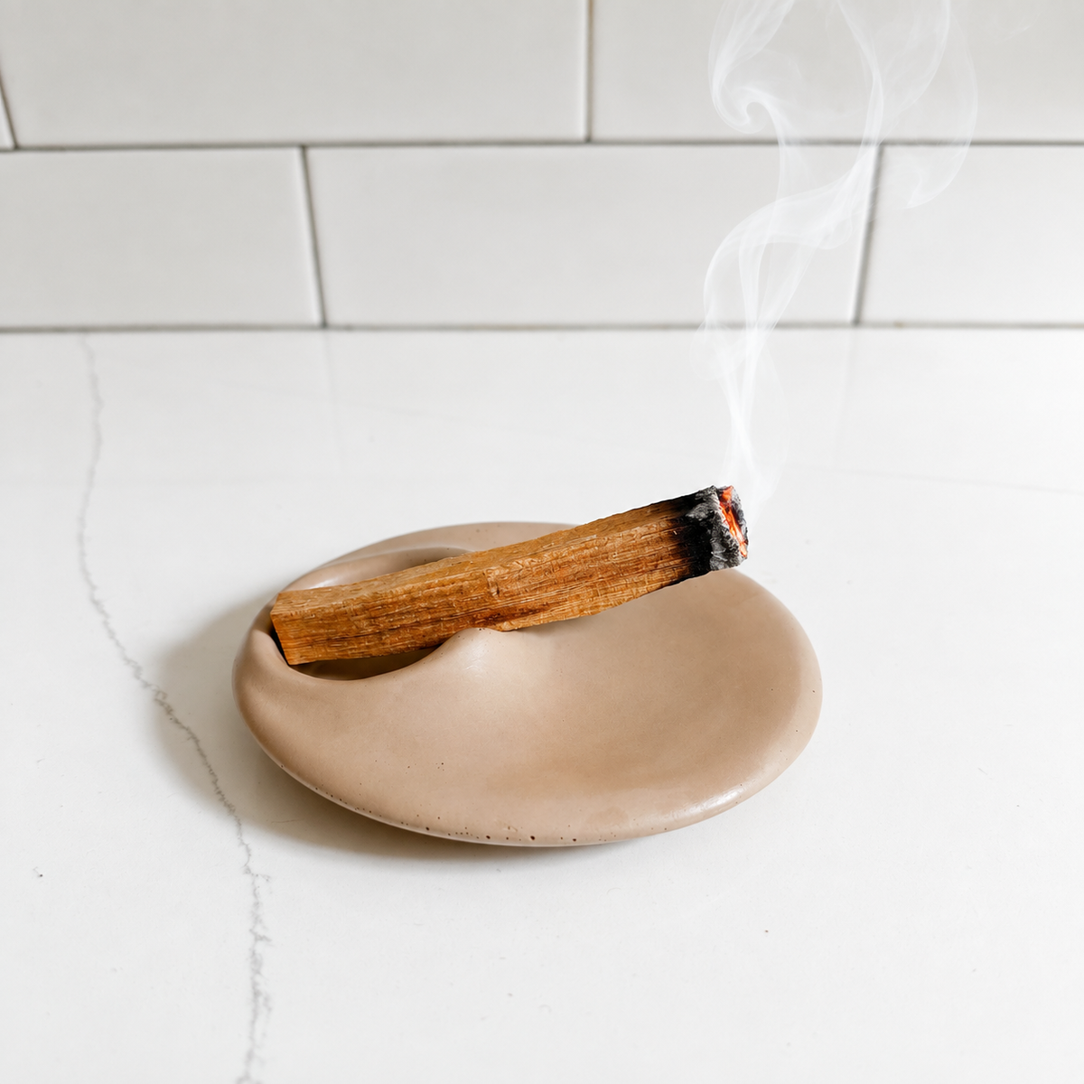 Burning Palo Santo on the concrete incense holder. 